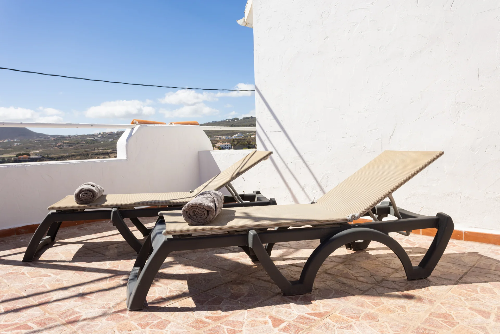 Terrace with sun loungers
